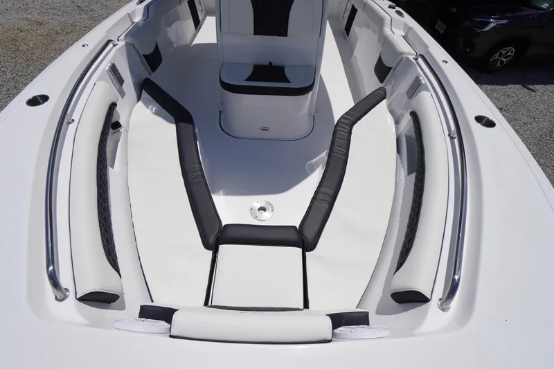 Slide: The Image of 2026 Tidewater 232 LXF boat interior with cushioned seating and sleek design. - 8