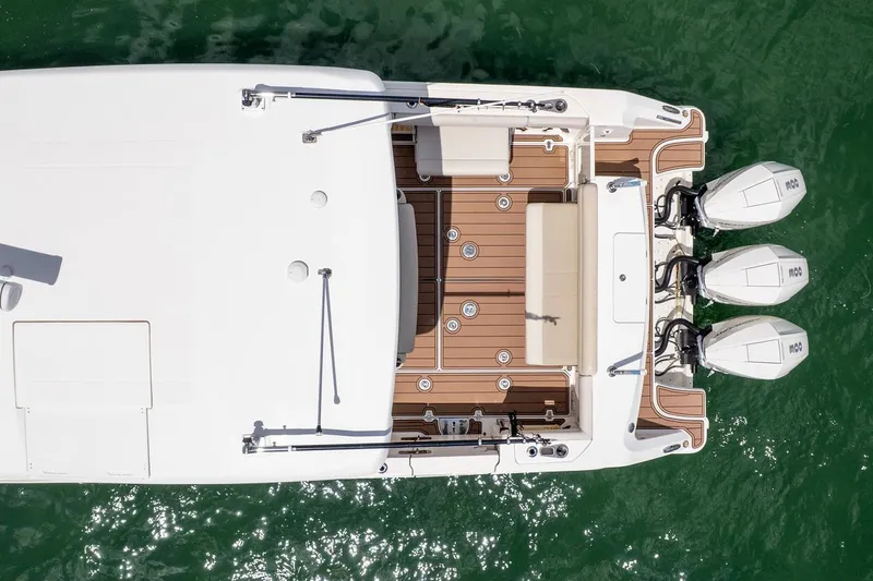 Slide: The Image of Aerial view of 2020 Boston Whaler 380 Outrage boat with triple engines. - 12