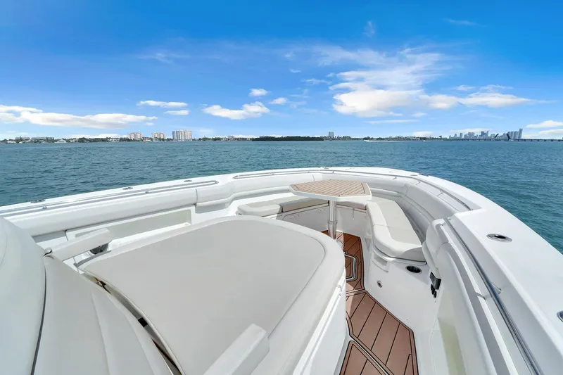 Slide: The Image of 2020 Boston Whaler 380 Outrage boat with spacious deck and ocean view. - 20