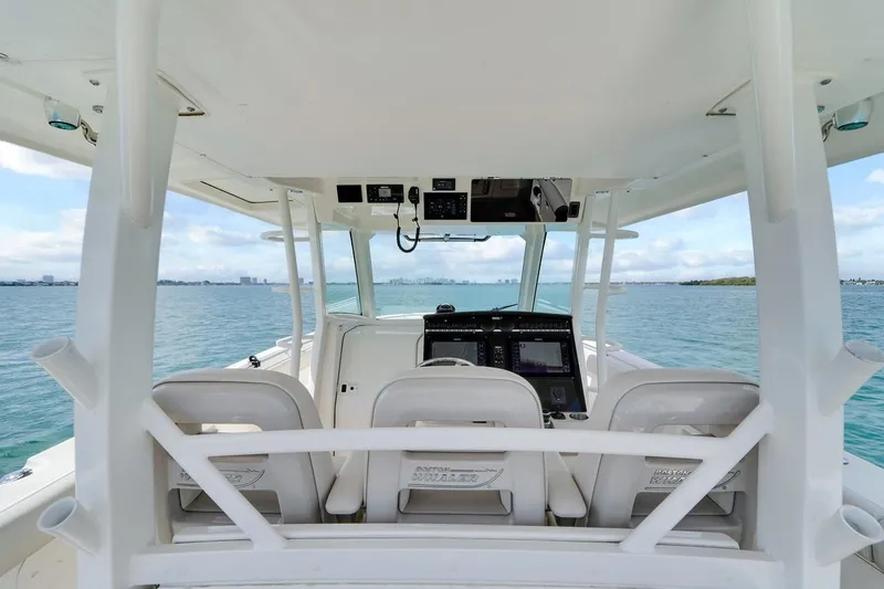 Slide: The Image of 2020 Boston Whaler 380 Outrage helm view, showcasing advanced navigation systems on open water. - 25
