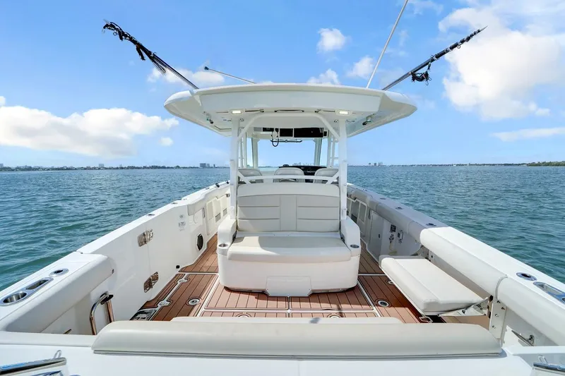 Slide: The Image of 2020 Boston Whaler 380 Outrage boat interior with seating, on open water. - 28