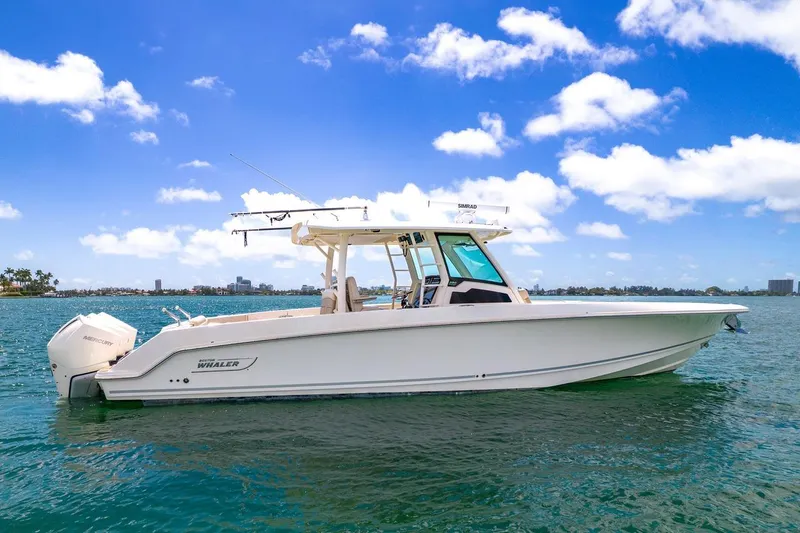 Slide: The Image of 2020 Boston Whaler 380 Outrage boat on clear blue water under a sunny sky. - 3