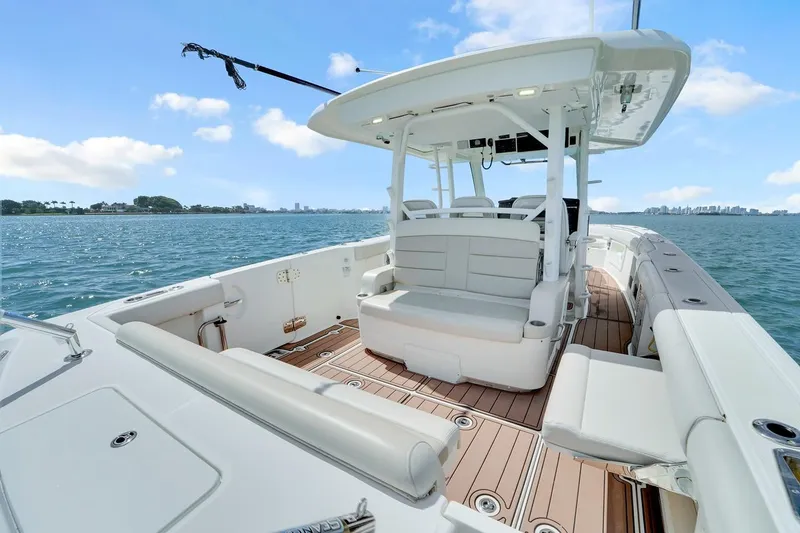 Slide: The Image of 2020 Boston Whaler 380 Outrage boat interior with seating, on a sunny day at sea. - 30