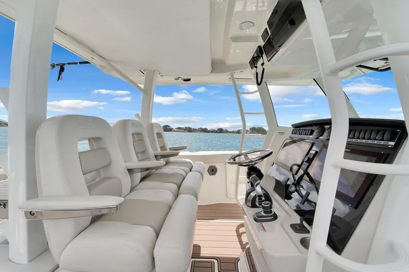 Slide: The Image of 2020 Boston Whaler 380 Outrage interior with luxurious seating and advanced navigation system. - 36