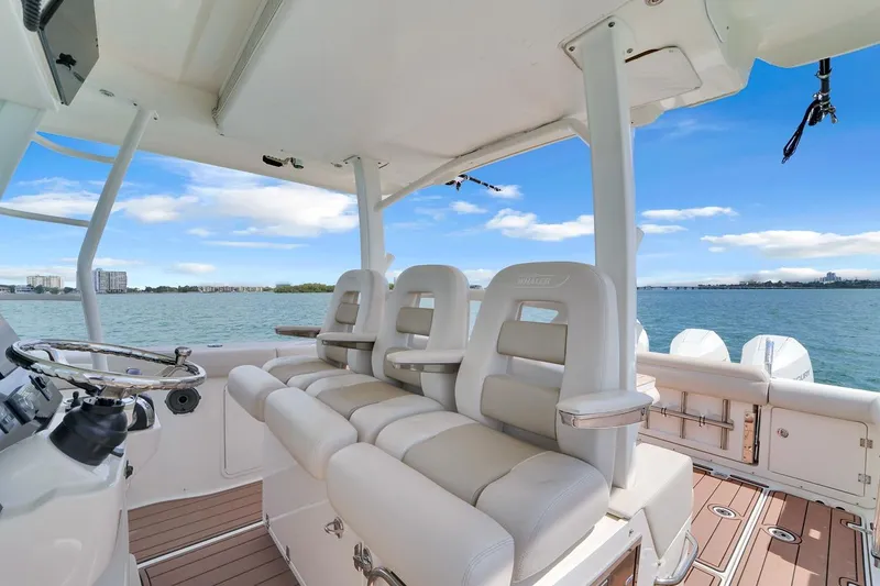 Slide: The Image of 2020 Boston Whaler 380 Outrage boat interior with luxurious seating and ocean view. - 39
