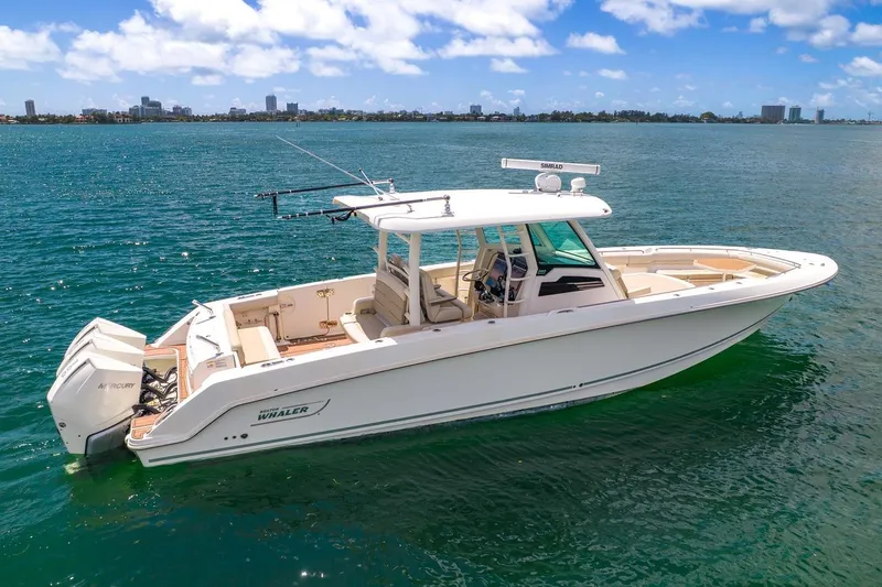 Slide: The Image of 2020 Boston Whaler 380 Outrage boat on clear blue water under a sunny sky. - 4