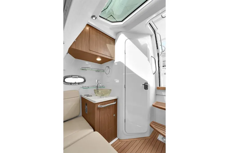 Slide: The Image of Interior of 2020 Boston Whaler 380 Outrage, featuring modern cabinetry and seating. - 50