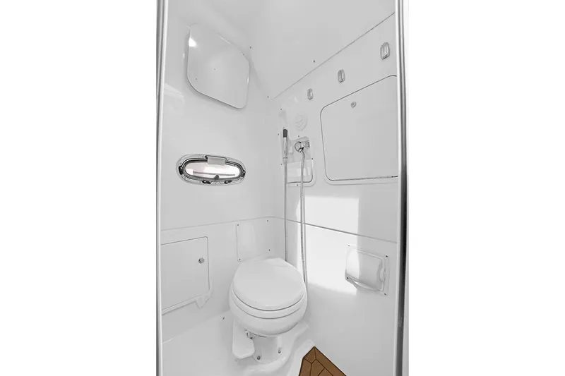Slide: The Image of 2020 Boston Whaler 380 Outrage boat bathroom interior with modern fixtures and white finish. - 52