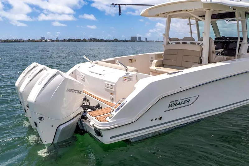Slide: The Image of 2020 Boston Whaler 380 Outrage boat with twin Mercury engines on the water. - 6