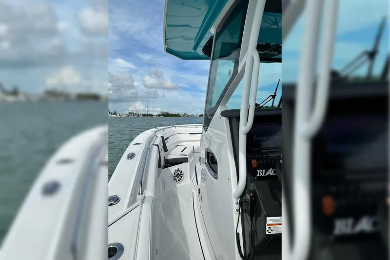 Slide: The Image of 2021 Blackfin 272 CC boat on water, showcasing sleek design and modern features. - 20