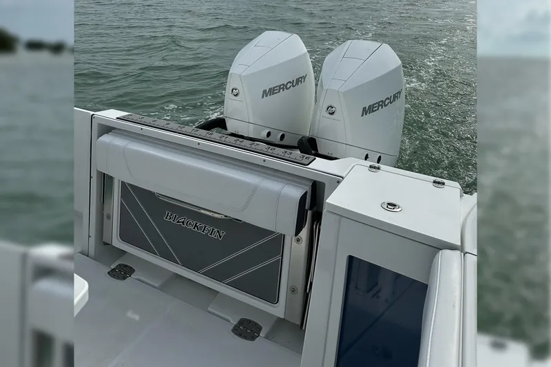 Slide: The Image of 2021 Blackfin 272 CC boat with dual Mercury engines on water. - 22