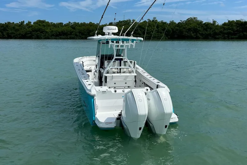 Slide: The Image of 2021 Blackfin 272 CC boat with twin engines on calm water. - 5