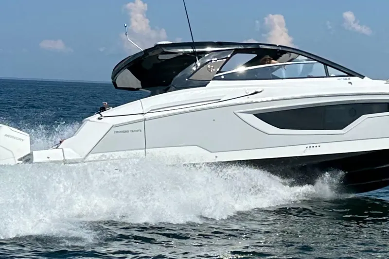 Slide: The Image of 2024 Cruisers Yachts 42 GLS OB speeding on open water. - 6