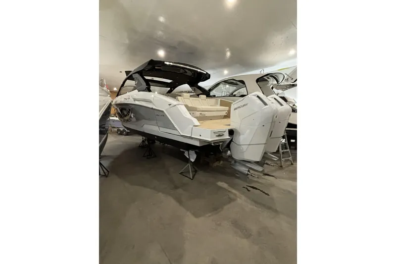Slide: The Image of 2024 Cruisers Yachts 42 GLS OB with dual outboard engines in showroom. - 9