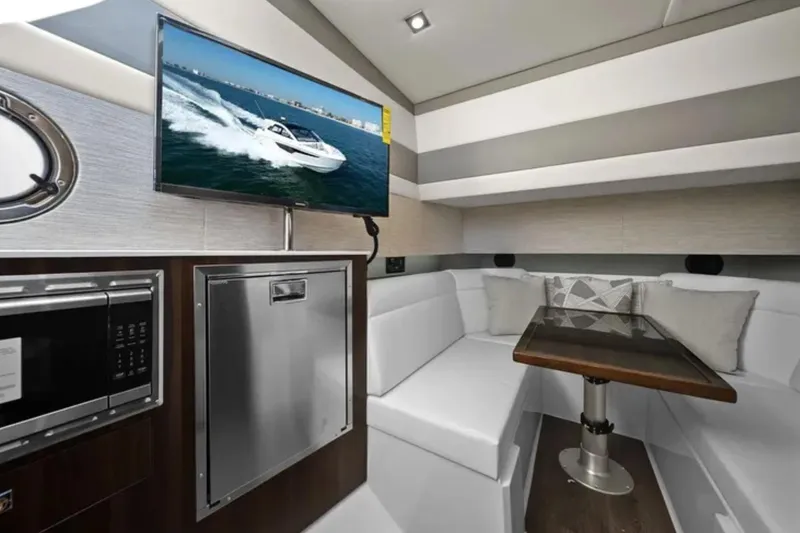 Slide: The Image of Luxurious interior of 2024 Cruisers Yachts 42 GLS OB with modern amenities and cozy seating. - 25