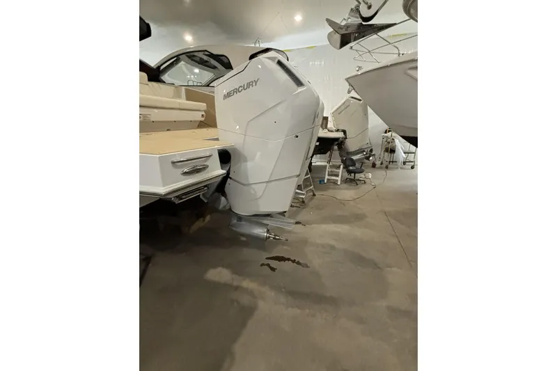 Slide: The Image of 2024 Cruisers Yachts 42 GLS OB with Mercury outboard engine in a showroom. - 10