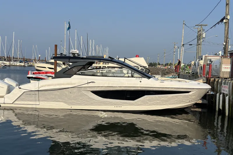 The Image of 2024 Cruisers Yachts 42 GLS OB docked at marina, showcasing sleek design and modern features. - 0