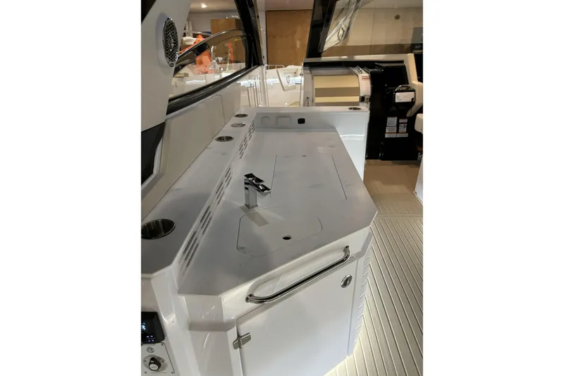 Slide: The Image of 2024 Cruisers Yachts 42 GLS OB interior with sleek countertop and modern fixtures. - 18