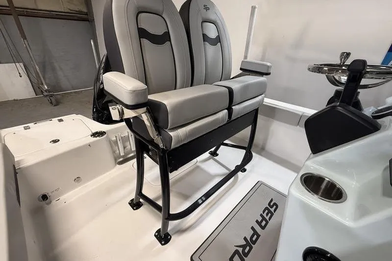 Slide: The Image of 2026 Sea Pro 202 Center Console boat interior with dual seats and steering console. - 12