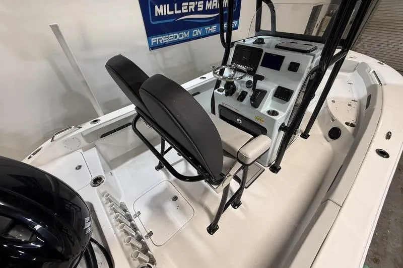 Slide: The Image of 2026 Sea Pro 202 Center Console boat interior with steering wheel and seating. - 13
