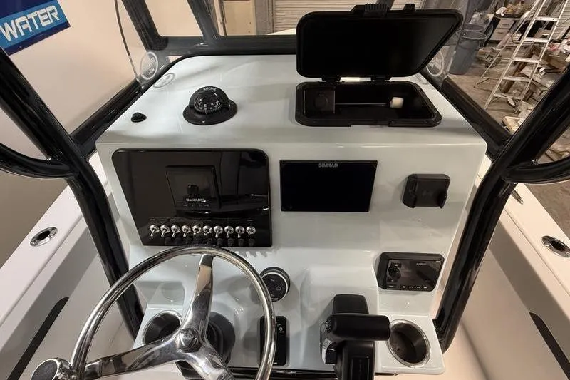 Slide: The Image of 2026 Sea Pro 202 Center Console dashboard with steering wheel and navigation controls. - 16