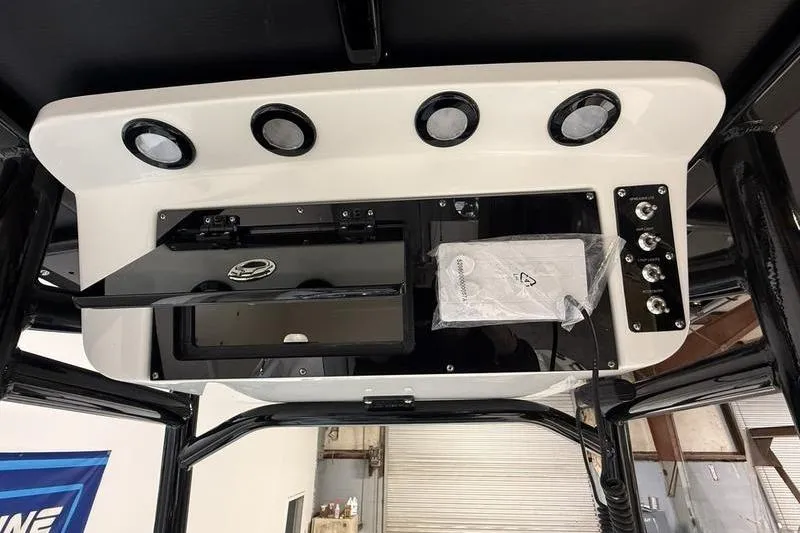 Slide: The Image of 2026 Sea Pro 202 Center Console dashboard with modern controls and storage compartments. - 19