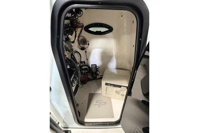Slide: The Image of 2026 Sea Pro 202 Center Console interior with wiring and equipment box. - 21