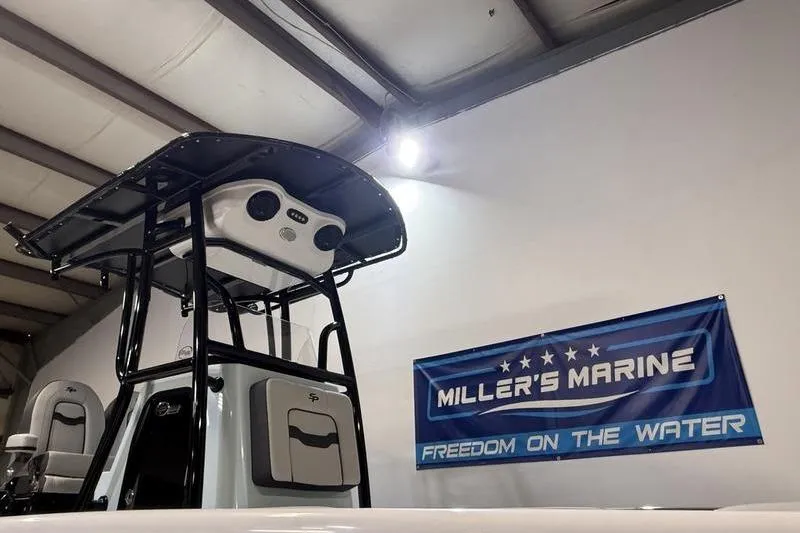 Slide: The Image of 2026 Sea Pro 202 Center Console boat displayed at Miller's Marine showroom. - 24