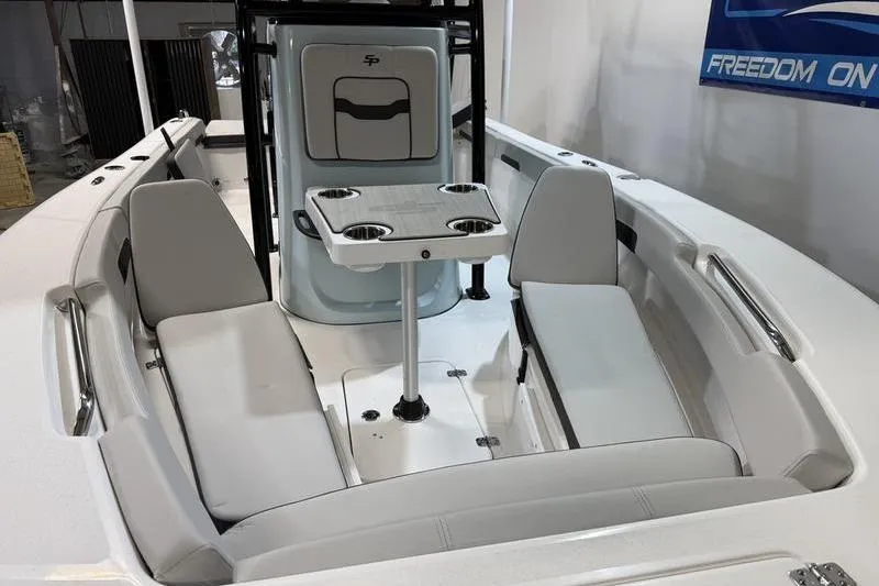 Slide: The Image of 2026 Sea Pro 202 Center Console boat interior with seating and table. - 27