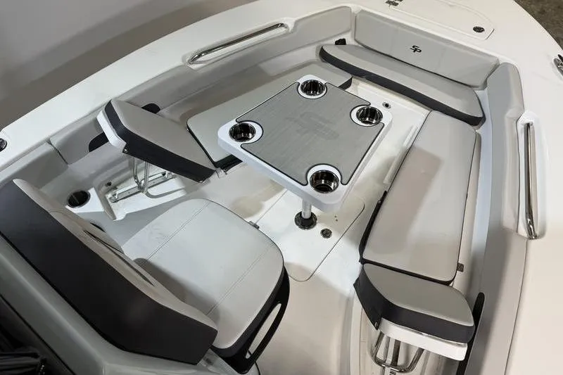 Slide: The Image of 2026 Sea Pro 202 Center Console boat interior with seating and table. - 28