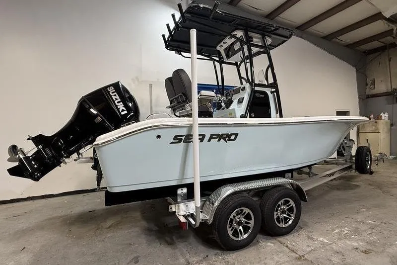 Slide: The Image of 2026 Sea Pro 202 Center Console boat on trailer in a garage. - 3