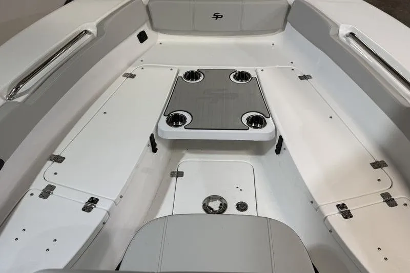Slide: The Image of 2026 Sea Pro 202 Center Console boat interior with seating and cup holders. - 30