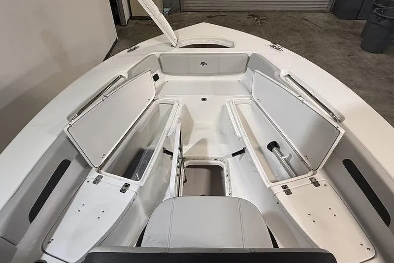 Slide: The Image of 2026 Sea Pro 202 Center Console boat interior with open storage compartments. - 32