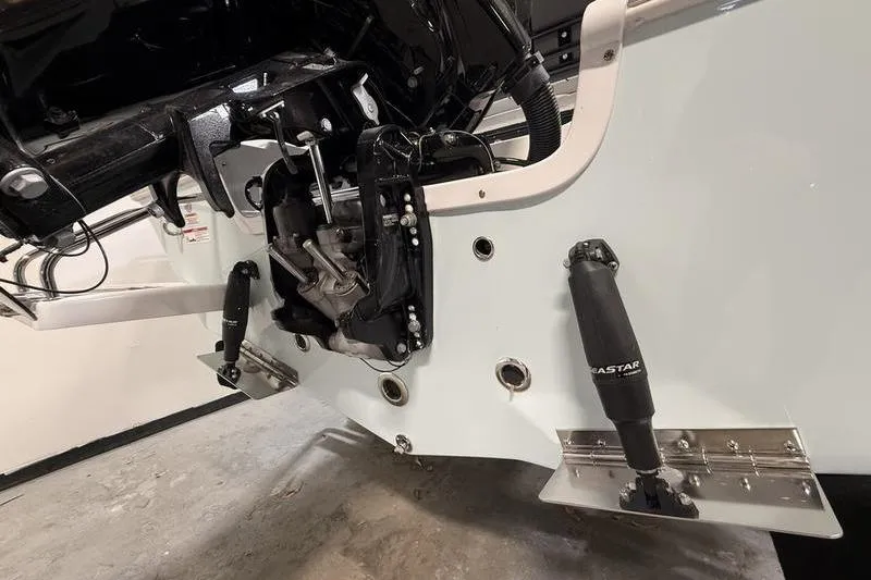 Slide: The Image of 2026 Sea Pro 202 Center Console boat engine and trim tabs detail. - 7