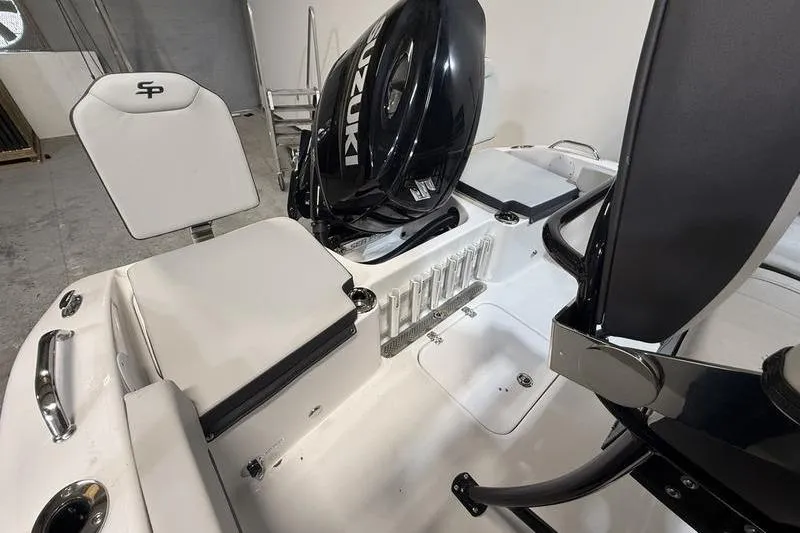Slide: The Image of 2026 Sea Pro 202 Center Console boat interior with Suzuki engine and seating. - 8