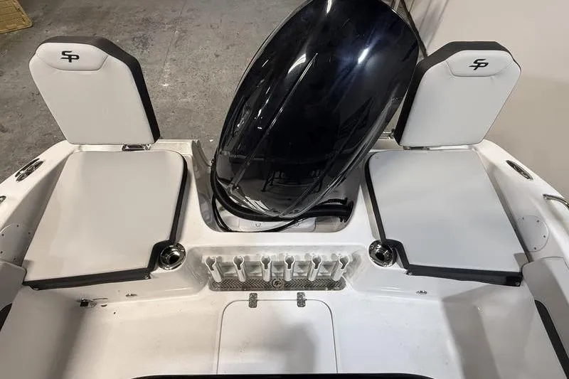 Slide: The Image of 2026 Sea Pro 202 Center Console boat interior with seating and engine view. - 9