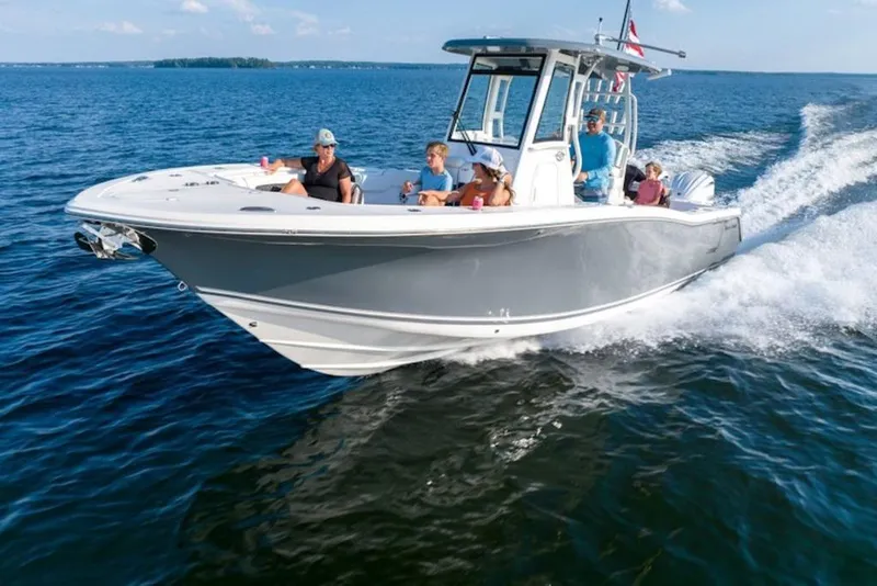 The Image of 2026 Tidewater 282 CC Adventure cruising on open water with passengers onboard. - 1