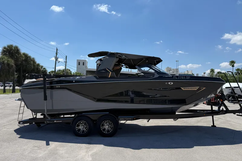 Slide: The Image of 2020 Nautique Super Air Nautique G25 Paragon boat on trailer under clear blue sky. - 6