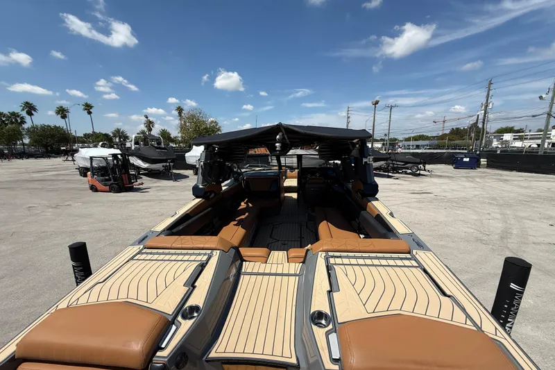 Slide: The Image of 2020 Nautique Super Air Nautique G25 Paragon boat with tan seating and sleek design. - 7