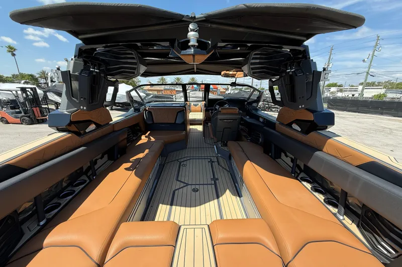 Slide: The Image of 2020 Nautique Super Air Nautique G25 Paragon interior with luxurious seating and advanced features. - 8