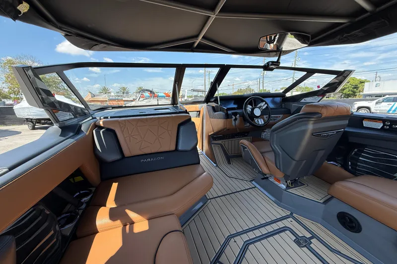 Slide: The Image of 2020 Nautique Super Air Nautique G25 Paragon interior with luxurious seating and modern dashboard. - 9