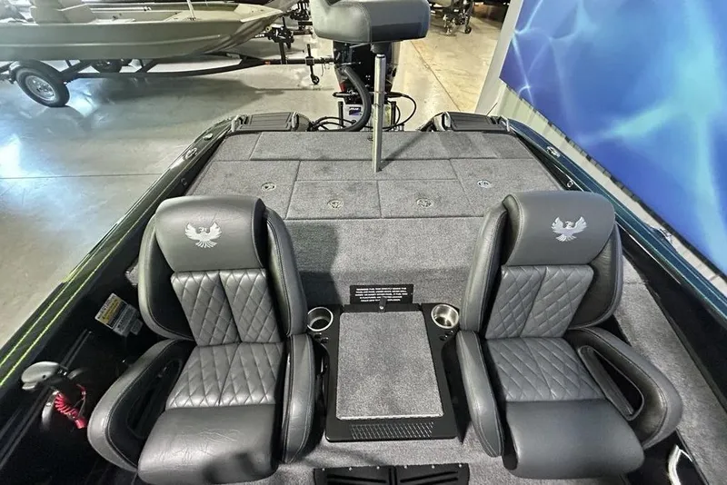 Slide: The Image of 2026 Phoenix 819 ZXL boat interior with dual seats and carpeted deck. - 10