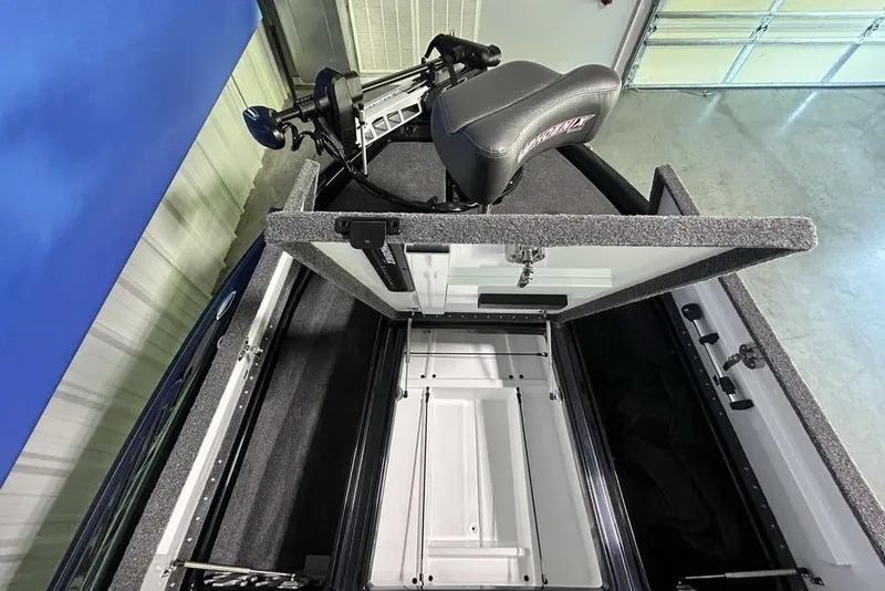 Slide: The Image of 2026 Phoenix 819 ZXL boat interior with open storage compartment and seat. - 12