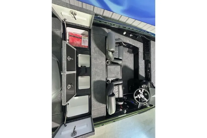 Slide: The Image of Interior view of 2026 Phoenix 819 ZXL boat with storage compartments and seating. - 16