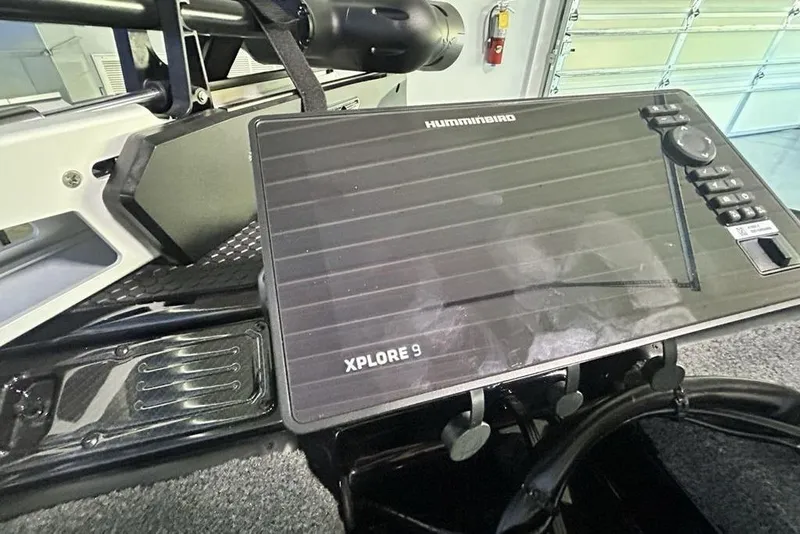 Slide: The Image of 2026 Phoenix 819 ZXL featuring Humminbird Xplore 9 navigation system in a modern interior. - 6