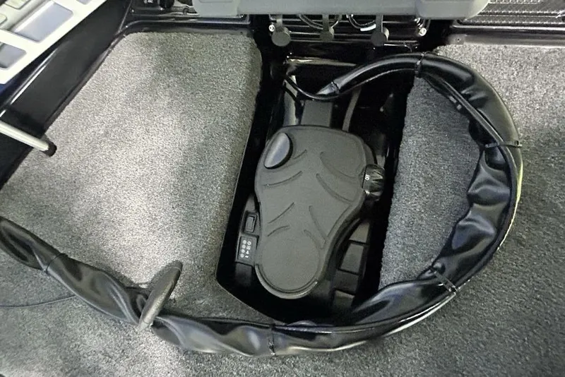 Slide: The Image of Foot pedal control in 2026 Phoenix 819 ZXL boat, surrounded by protective padding. - 7