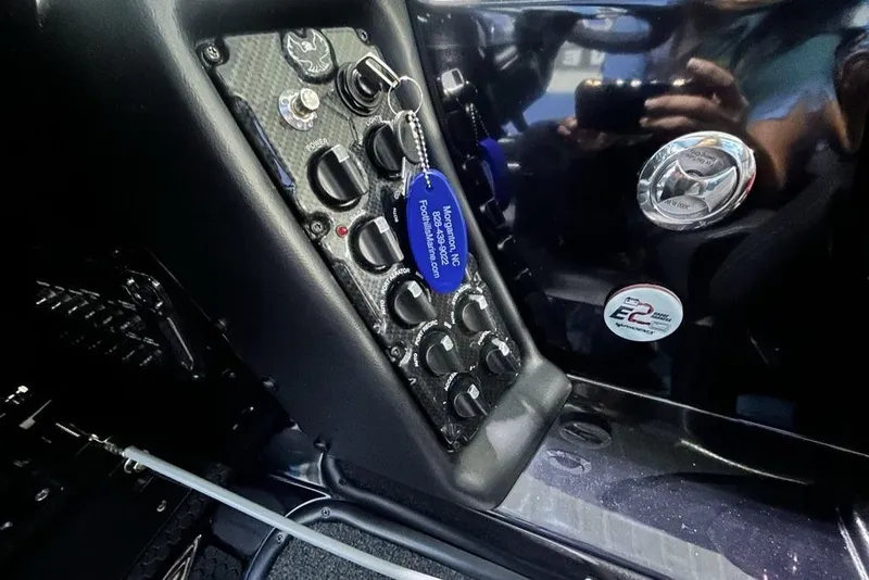 Slide: The Image of Control panel of 2026 Phoenix 819 ZXL with switches and keychain. - 9
