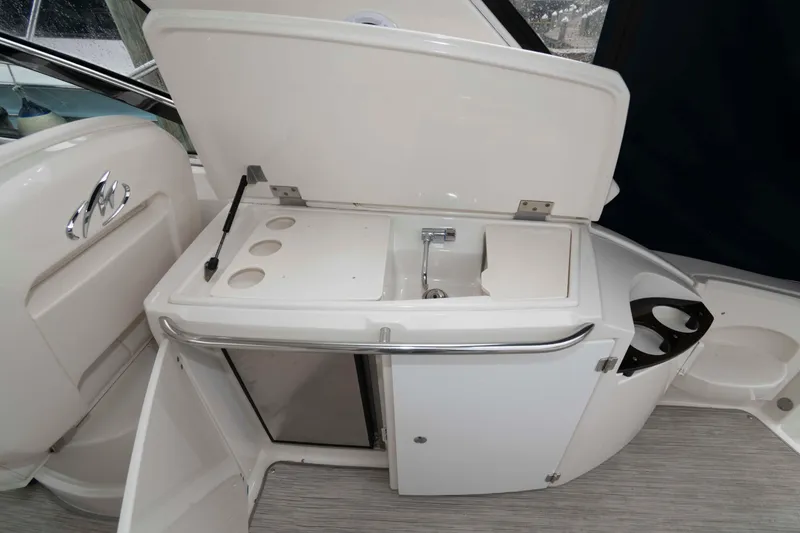 Slide: The Image of 2008 Monterey 350 Sport Yacht kitchenette with sink and storage. - 10