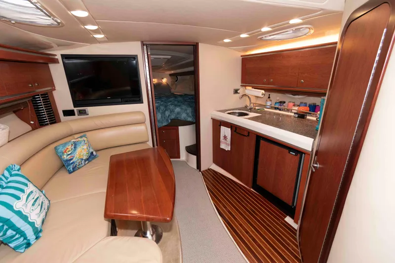 Slide: The Image of Luxurious interior of a 2008 Monterey 350 Sport Yacht with kitchen and seating area. - 15