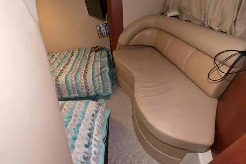 Slide: The Image of Interior cabin of 2008 Monterey 350 Sport Yacht with beds and beige seating. - 18